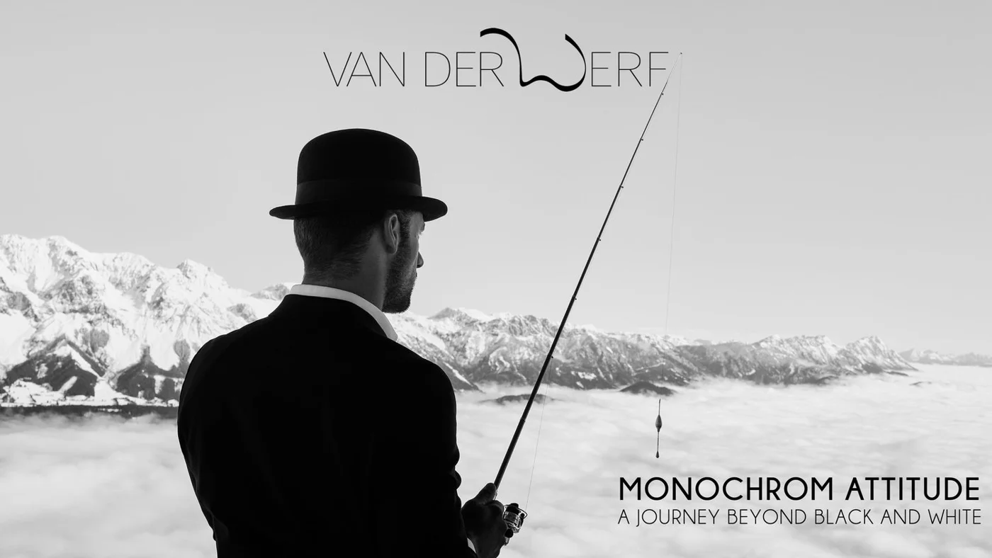 Black and white photo of a man in a bowler hat holding a fishing rod, standing with mountain scenery in the background. Text reads, 'Van Der Werf, Monochrom Attitude: A Journey Beyond Black and White.'